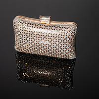 Click on this photo of a sparkly woman's purse on a black surface with a clear reflection and you will get transferred to a page with still photography images