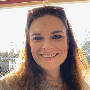 Image of white female with long brown hair smiling