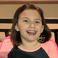 Image of female child smiling with braces