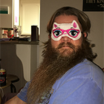 Image of man wearing a cat sleep mask