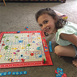 Image of young girl playing a board game