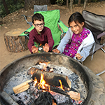 Image of kids by a campfire