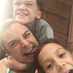 Image of woman and 2 children making silly faces
