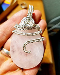 Rose quartz wrapped in silver wire