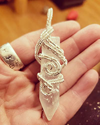selenite point wrapped in sterling silver wire
