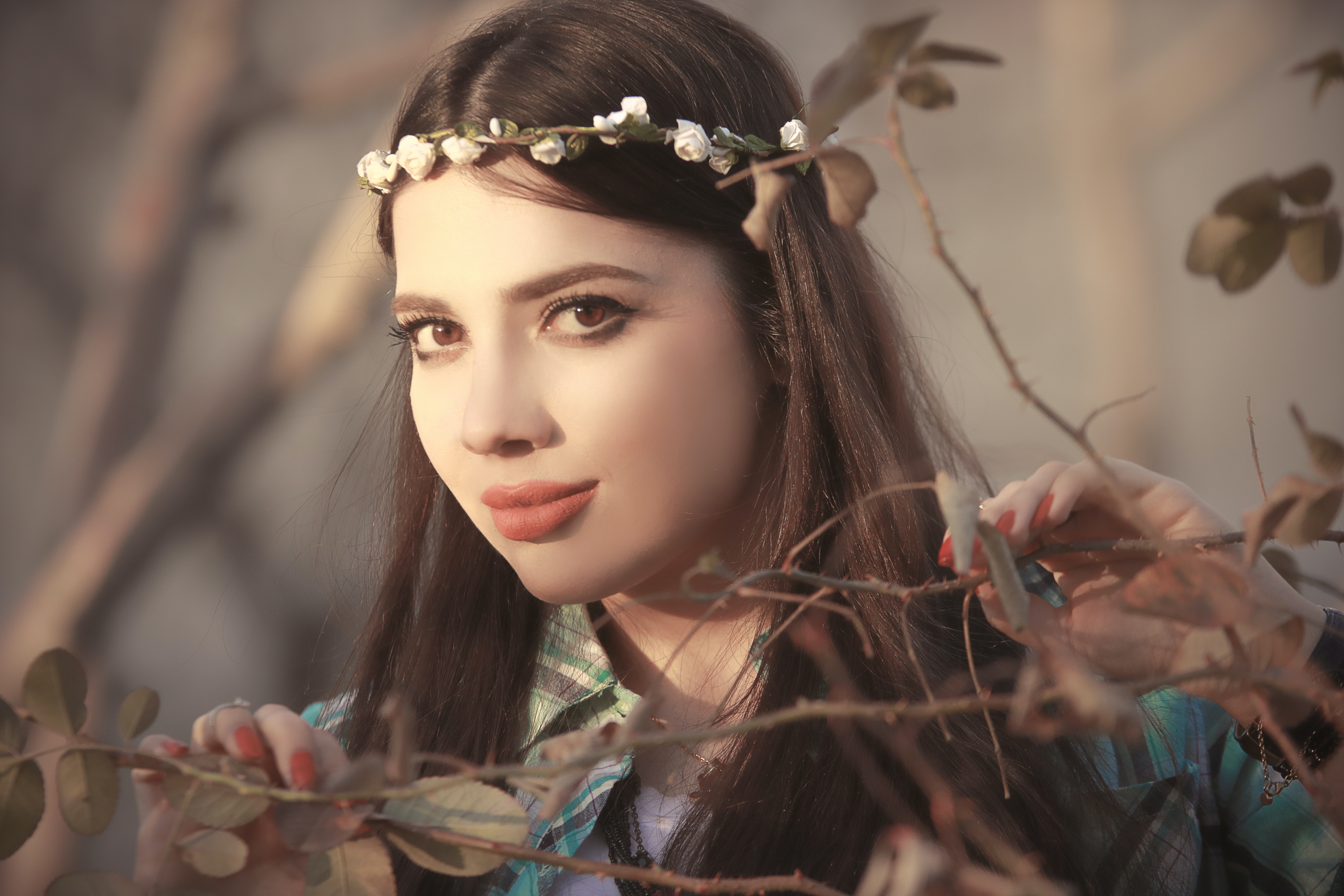 realistic painting of a ladies face with flower tiara