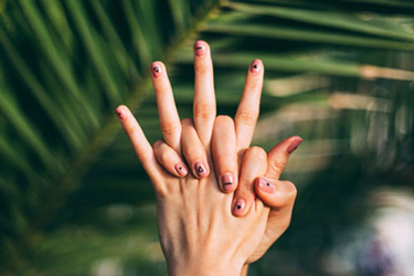 hands intertwined with lined nail polish