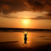 a girl staring at the sunset