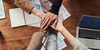 our team putting our hands together