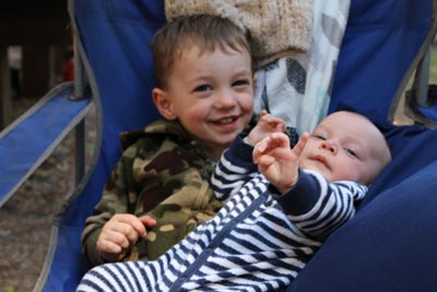 boy holding his baby sister