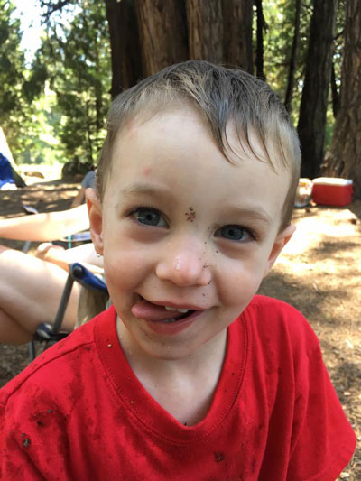 boy with water on his face